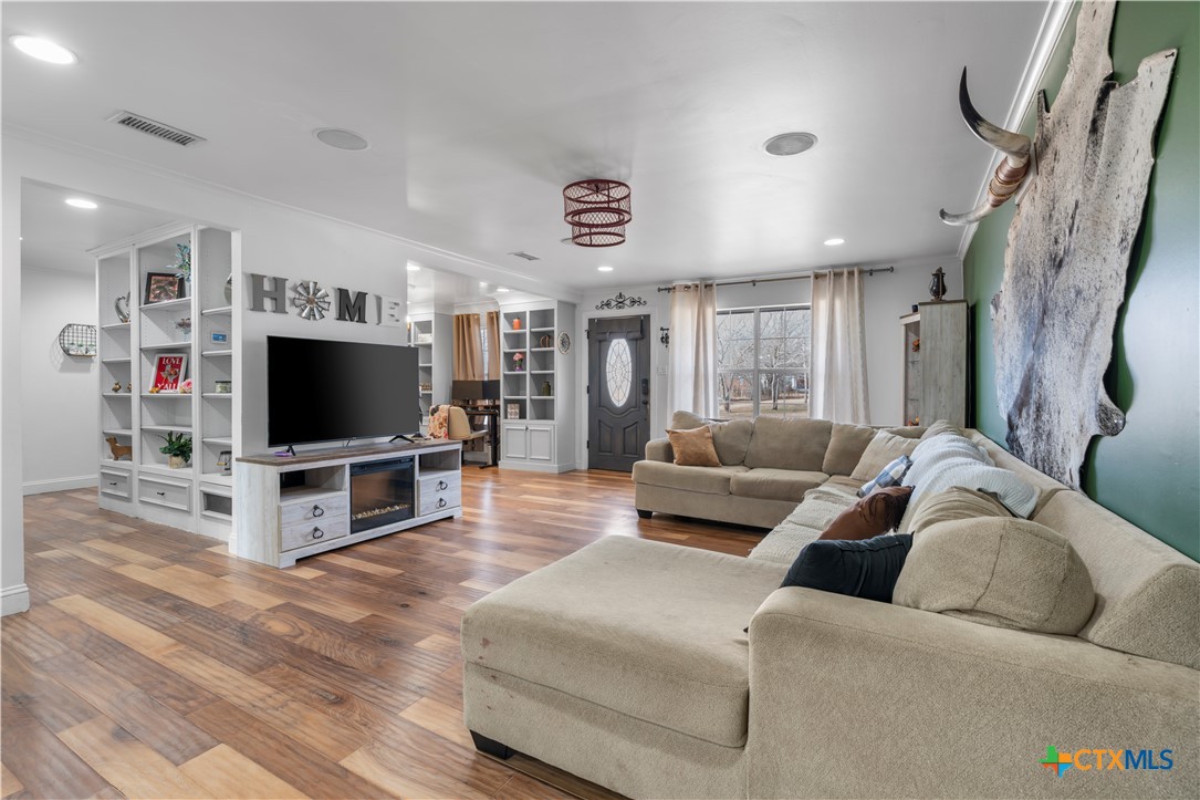 308 Liberty Street Gatesville, TX 76528 - Photo 27 of 41 a living room with furniture and a flat screen tv