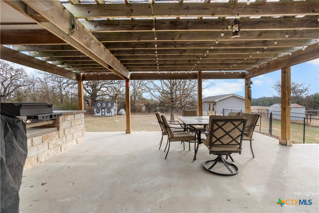 308 Liberty Street Gatesville, TX 76528 - Photo 29 of 41 a view of a chairs and table in the patio