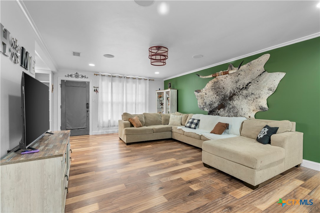 308 Liberty Street Gatesville, TX 76528 - Photo 3 of 41 a living room with furniture and a flat screen tv