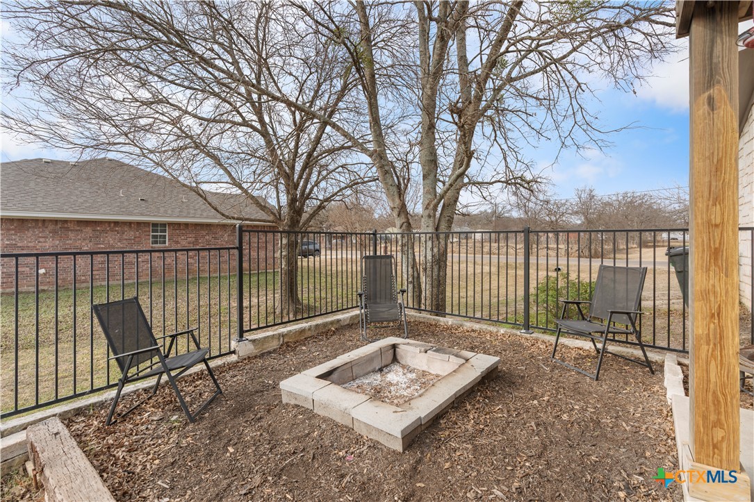 308 Liberty Street Gatesville, TX 76528 - Photo 31 of 41 a view of a chairs and wooden deck