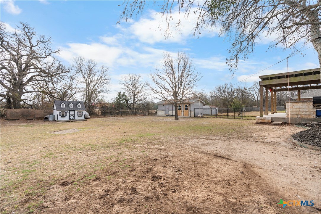 308 Liberty Street Gatesville, TX 76528 - Photo 32 of 41 a view of outdoor space with deck and trees