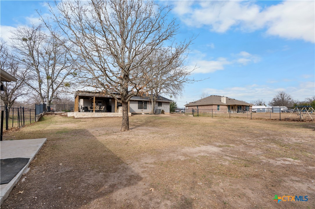 308 Liberty Street Gatesville, TX 76528 - Photo 34 of 41 a front view of a house with large trees