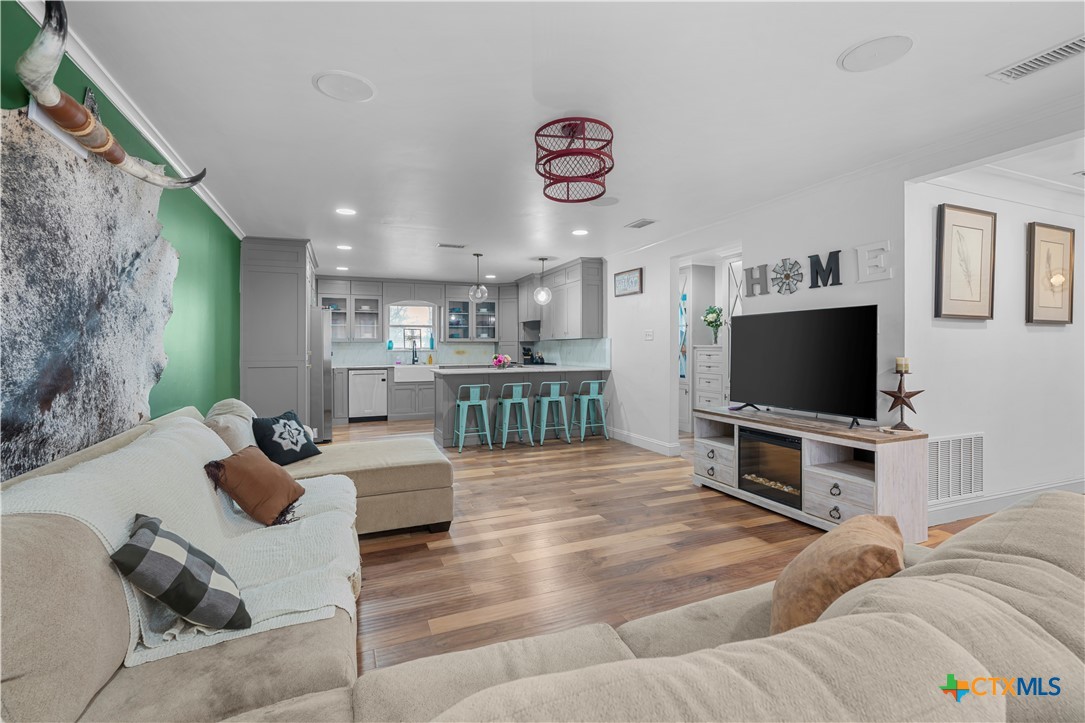 308 Liberty Street Gatesville, TX 76528 - Photo 4 of 41 a living room with furniture and a flat screen tv