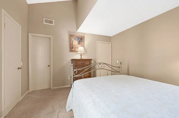 a bedroom with a bed and a closet