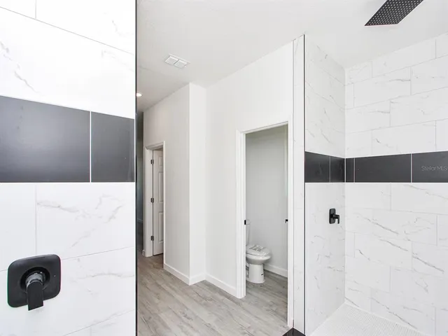 a kitchen with a sink and a refrigerator