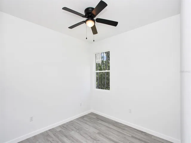 a bathroom with a bathtub shower sink vanity and toilet