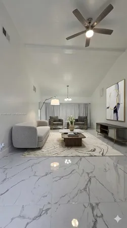 a view of living room with furniture and a ceiling fan