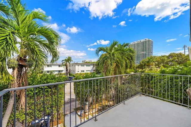 a view of a balcony with an outdoor space