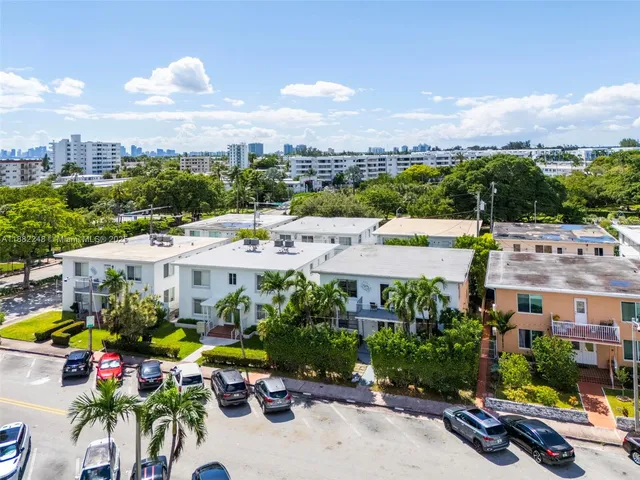 an aerial view of residential houses and outdoor space