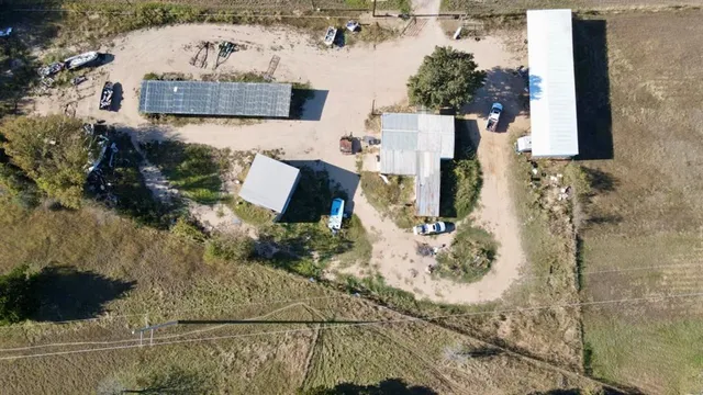 an aerial view of a house with outdoor space