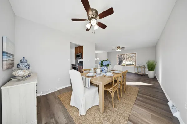 a street view with couple of cars parked on road