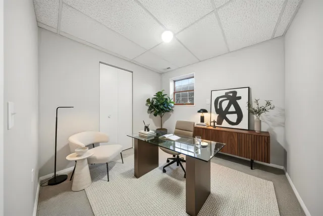 a view of a workspace with furniture