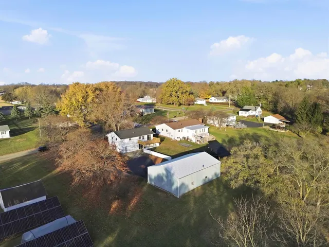 a street view with couple of cars parked on road