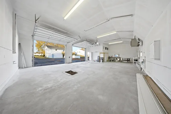 a kitchen with stainless steel appliances granite countertop a refrigerator stove top oven and sink