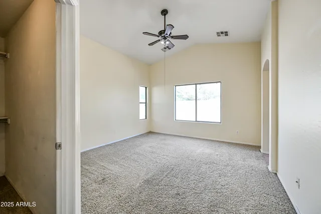 an empty room that has a window in it