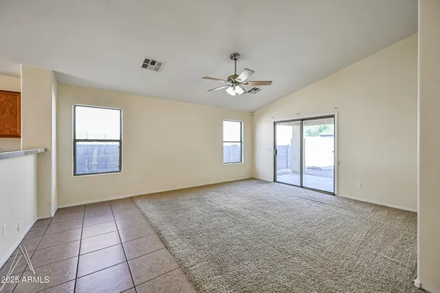 a view of an empty room with windows