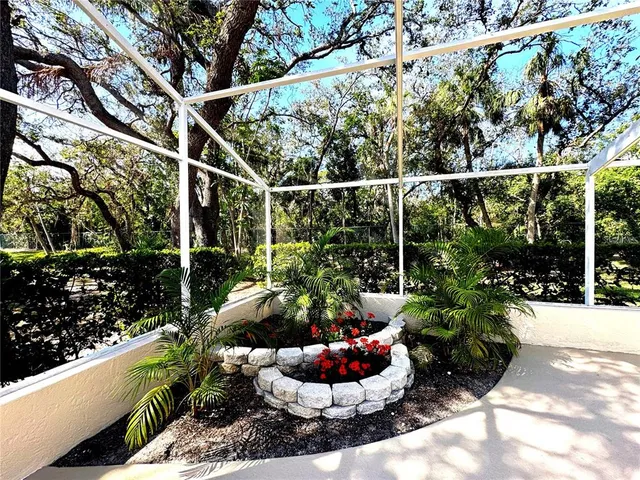 a view of a patio with table and chairs potted plants with wooden floor