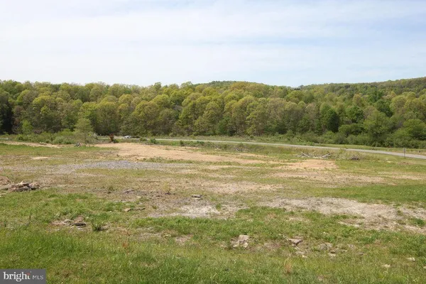 a view of a town with mountains in the background