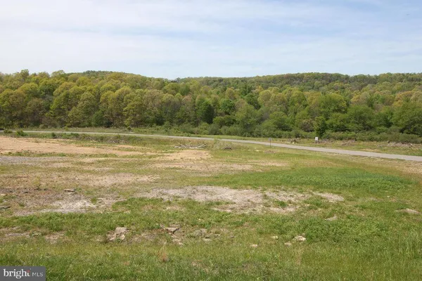 a view of a town with mountains in the background