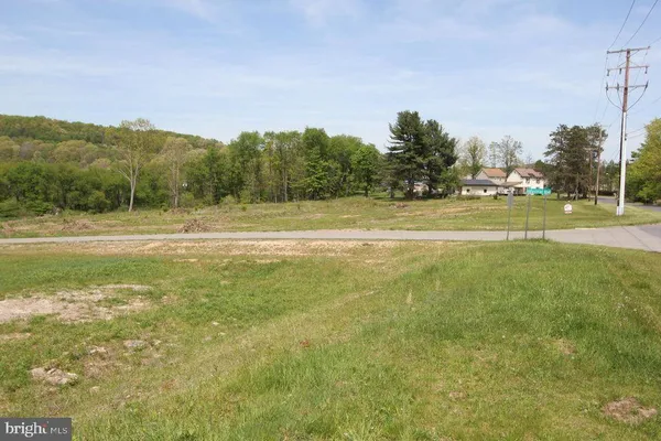 a view of a lake with houses in the back