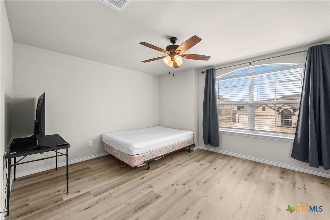 1305 Roma Street Harker Heights, TX 76548 - Photo 15 of 28 a bedroom with furniture and a window