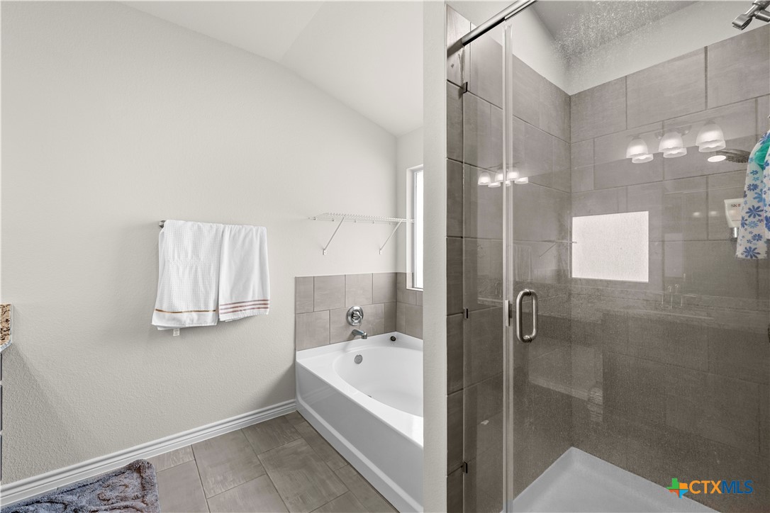 1305 Roma Street Harker Heights, TX 76548 - Photo 20 of 28 a bathroom with a bathtub and a shower