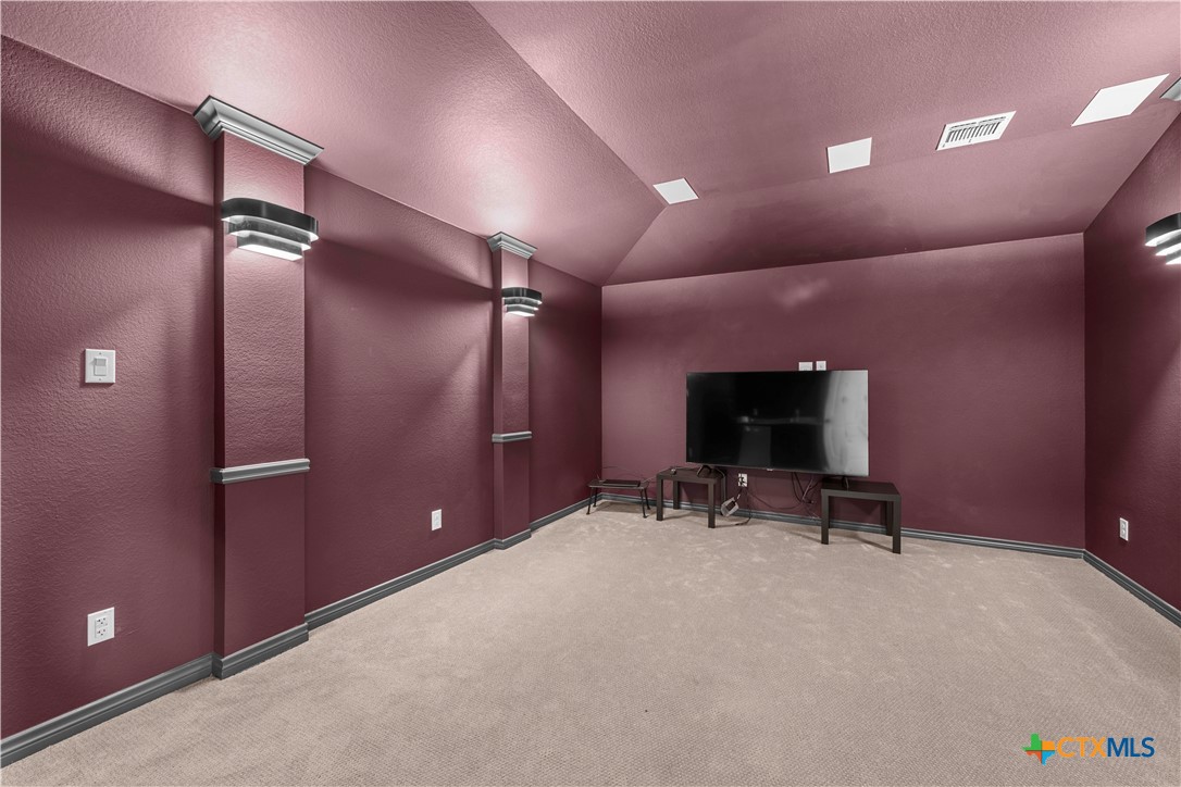 1305 Roma Street Harker Heights, TX 76548 - Photo 22 of 28 a view of a room with gym equipment and a projector screen