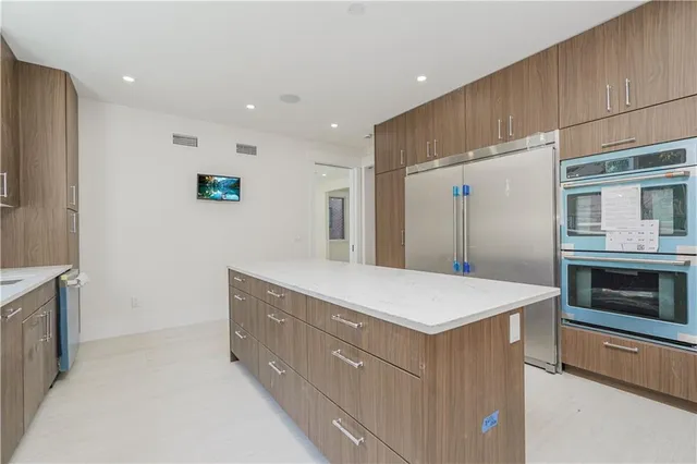 a bathroom with a sink a vanity and a mirror