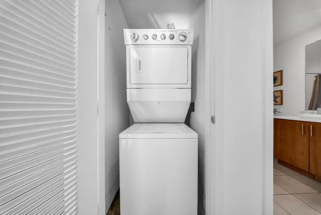a bedroom with a large bed and a large window