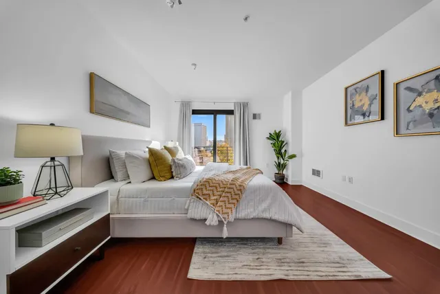 a view of parking garage with cars parked