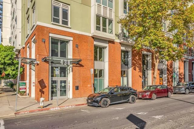 a living room with furniture and next to a window