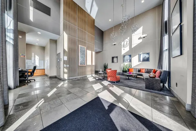 a kitchen with stainless steel appliances a refrigerator and a stove top oven