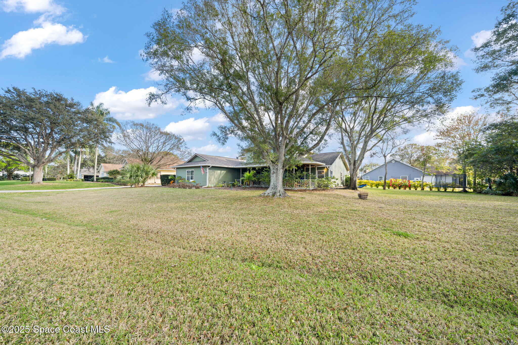 3705 Eagle Way Melbourne, FL 32934 - Photo 11 of 47 a view of outdoor space with garden and trees