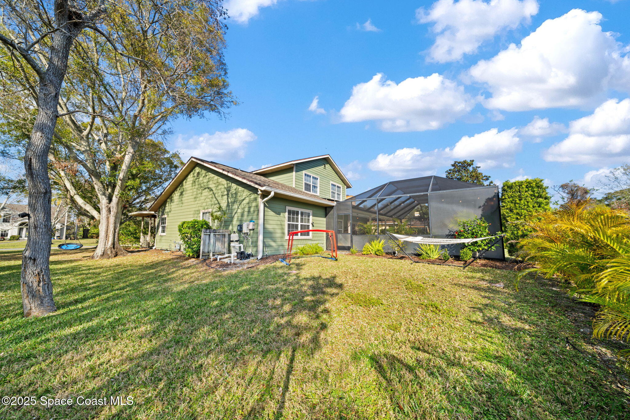3705 Eagle Way Melbourne, FL 32934 - Photo 13 of 47 a view of a house with a big yard and large tree