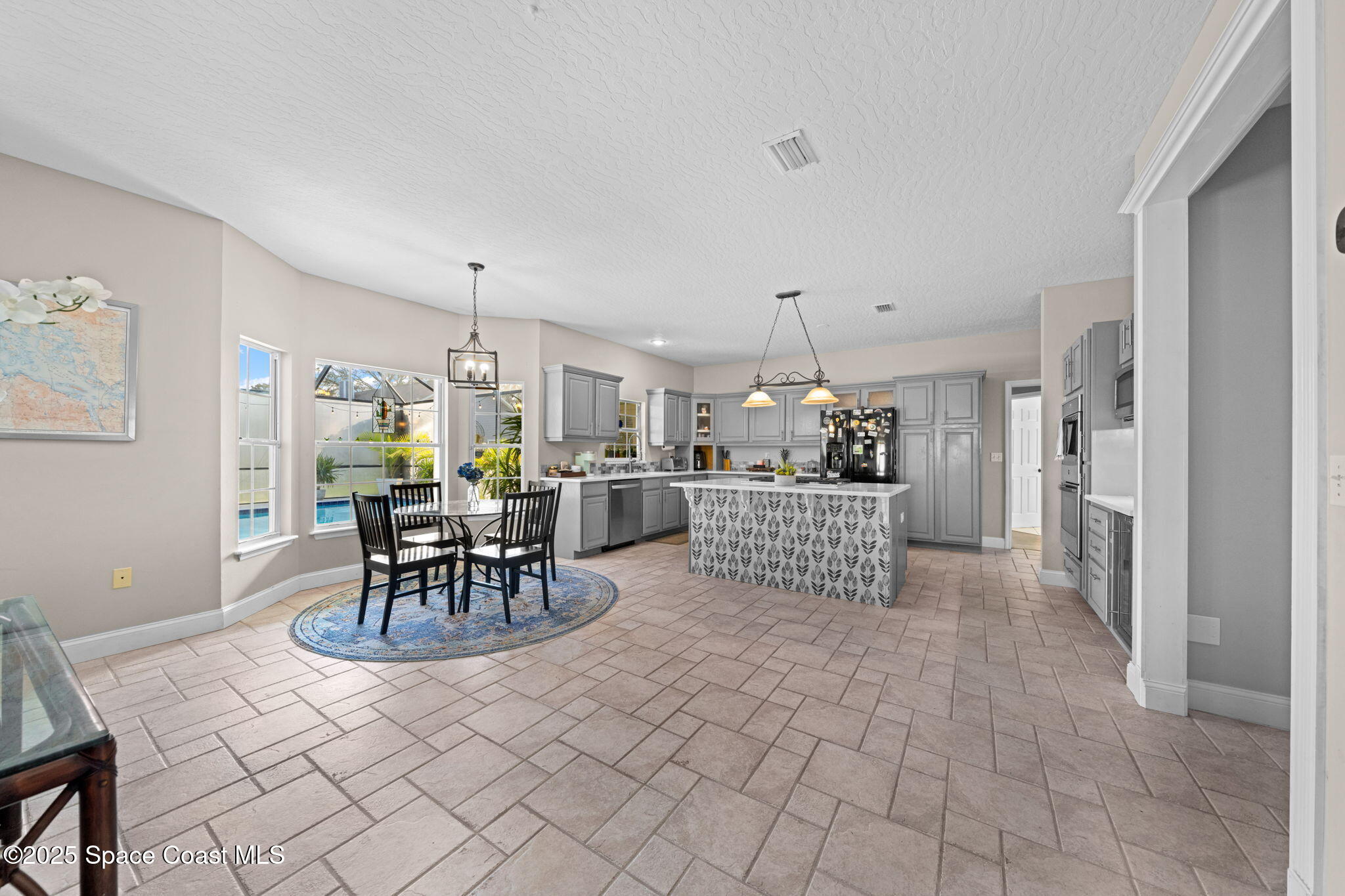 3705 Eagle Way Melbourne, FL 32934 - Photo 19 of 47 a view of a dining room kitchen and furniture