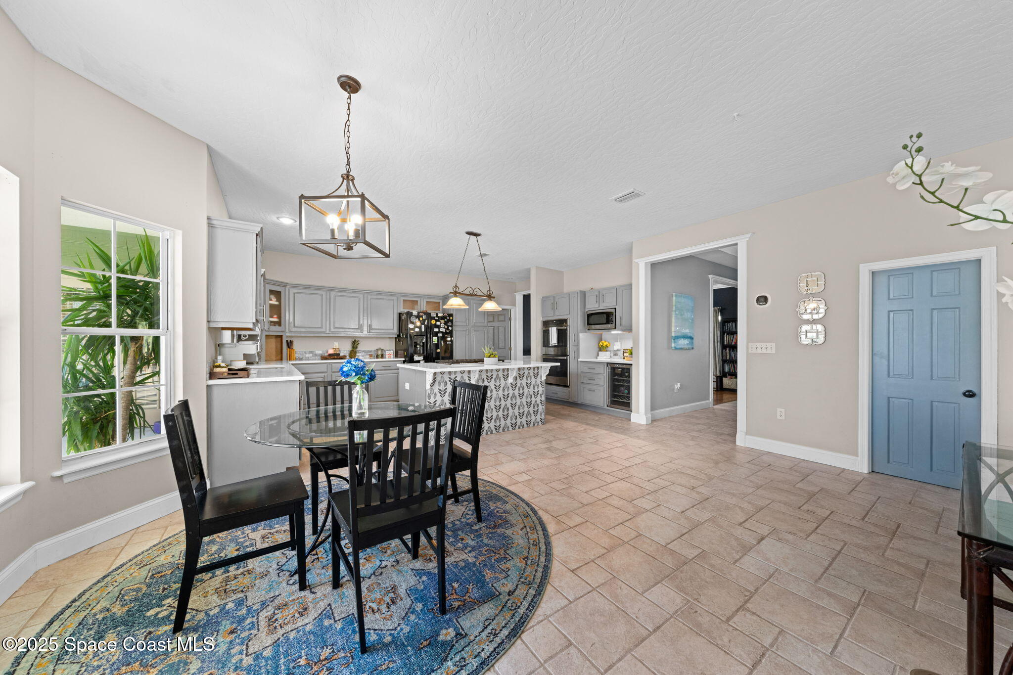 3705 Eagle Way Melbourne, FL 32934 - Photo 20 of 47 a view of a dining room with furniture window and outside view