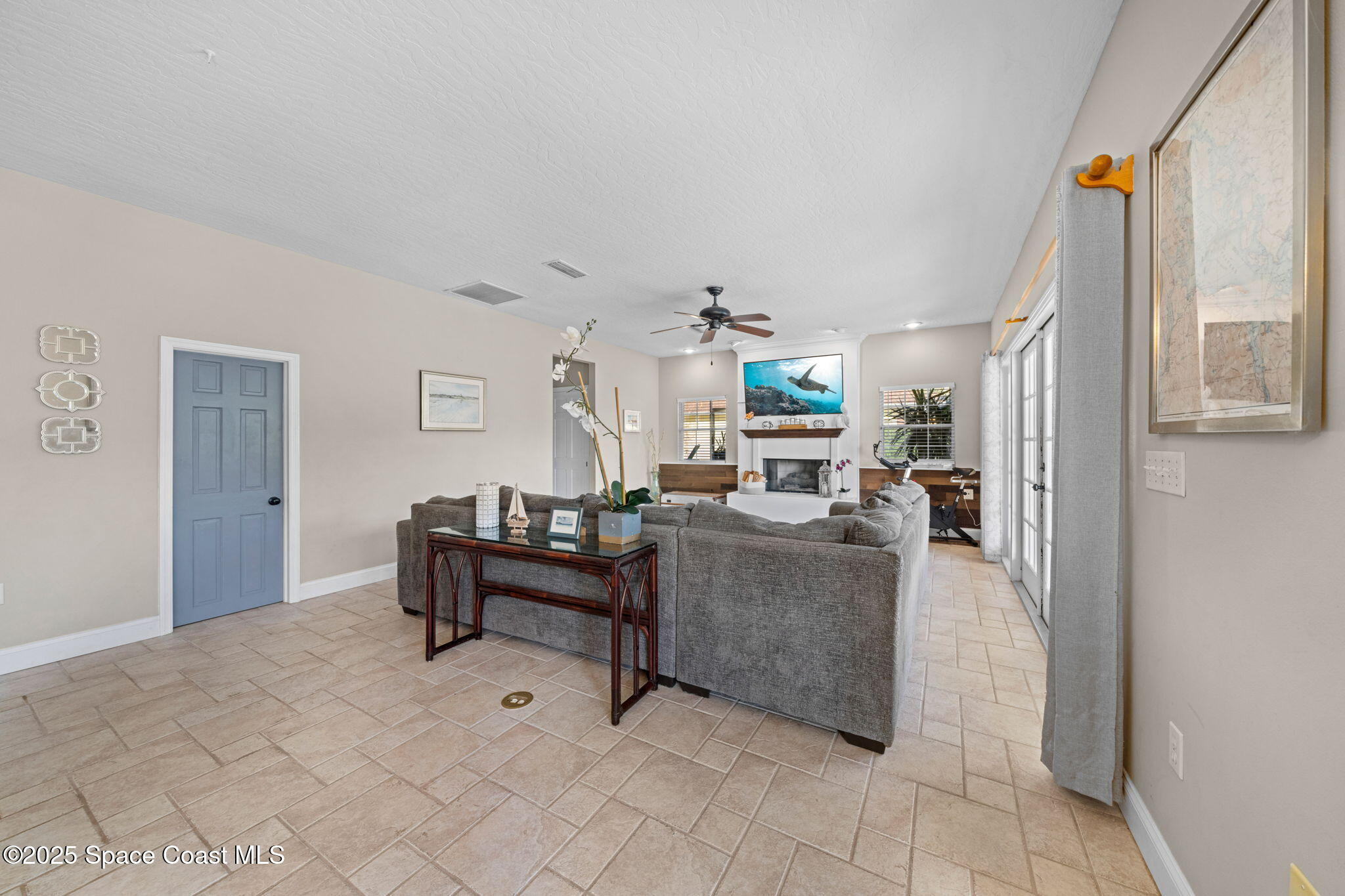 3705 Eagle Way Melbourne, FL 32934 - Photo 21 of 47 a living room with furniture and a table