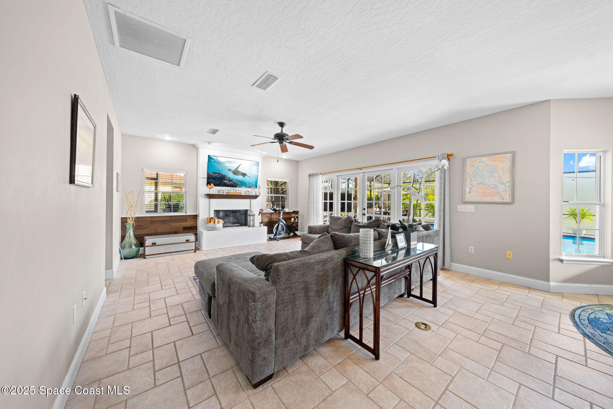 3705 Eagle Way Melbourne, FL 32934 - Photo 22 of 47 a living room with fireplace furniture and a window