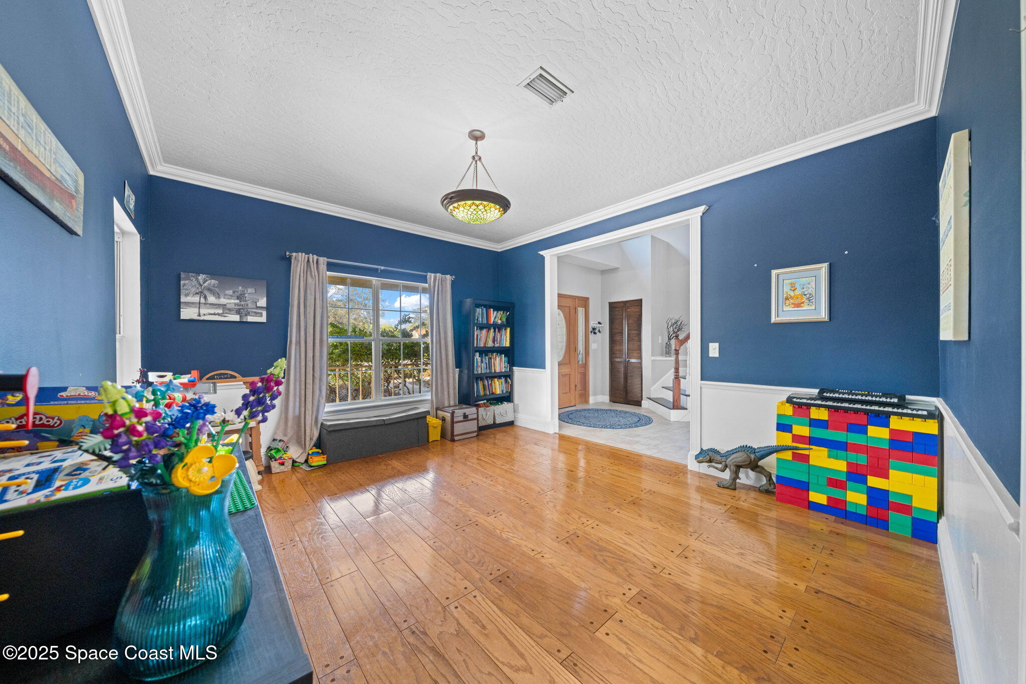 3705 Eagle Way Melbourne, FL 32934 - Photo 26 of 47 a living room with furniture and a soccer table