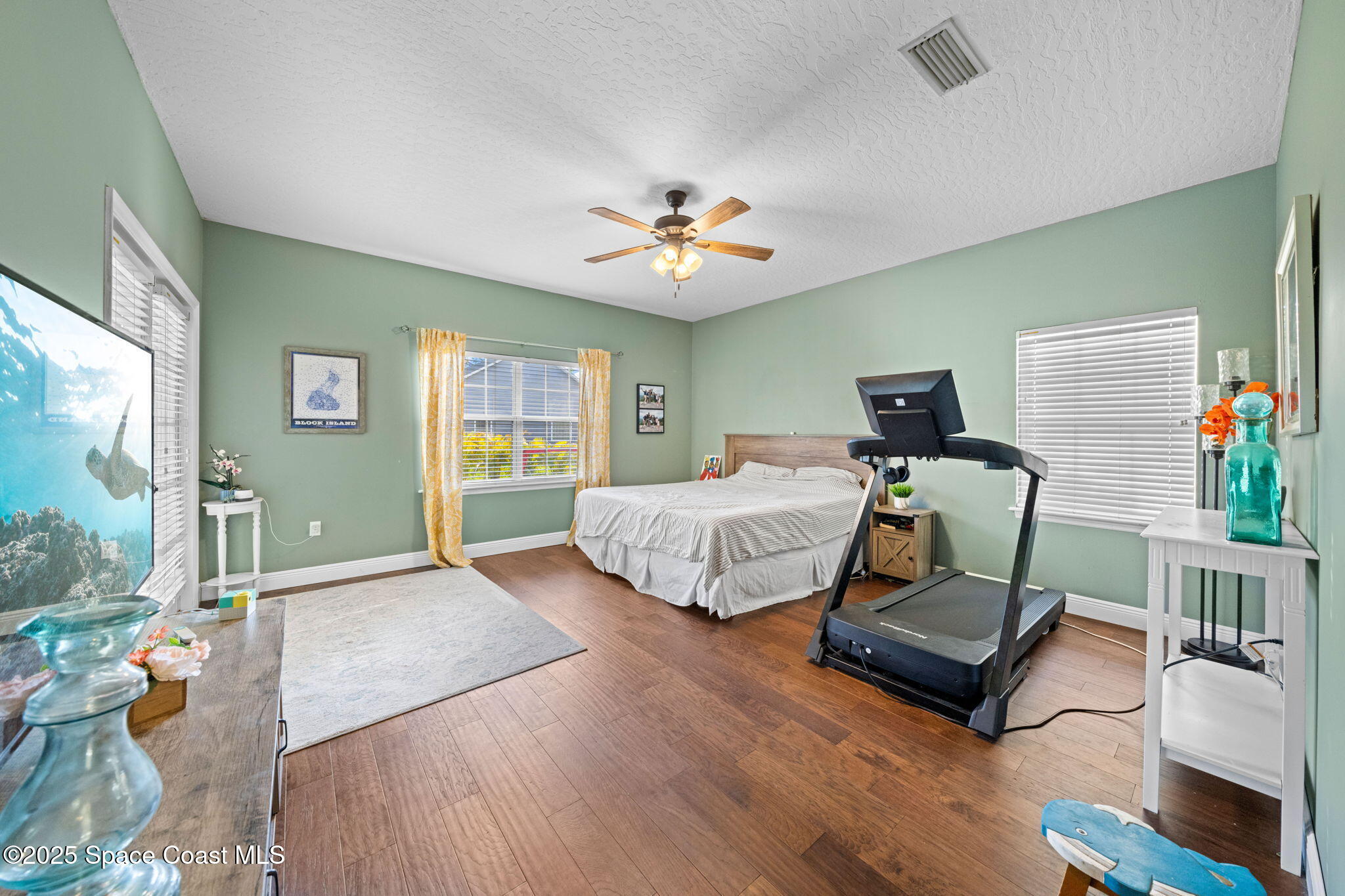3705 Eagle Way Melbourne, FL 32934 - Photo 28 of 47 a bedroom with furniture and a potted plant