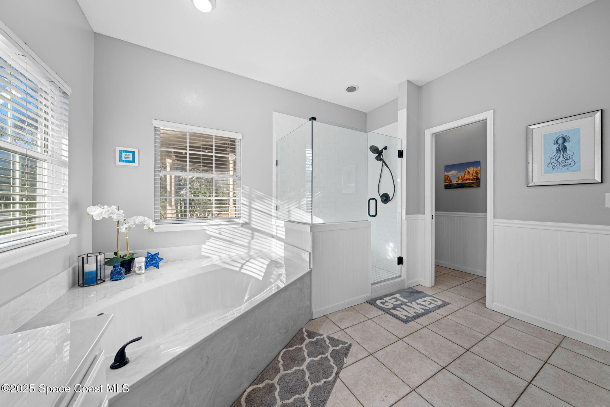 3705 Eagle Way Melbourne, FL 32934 - Photo 31 of 47 a spacious bathroom with a tub shower and window