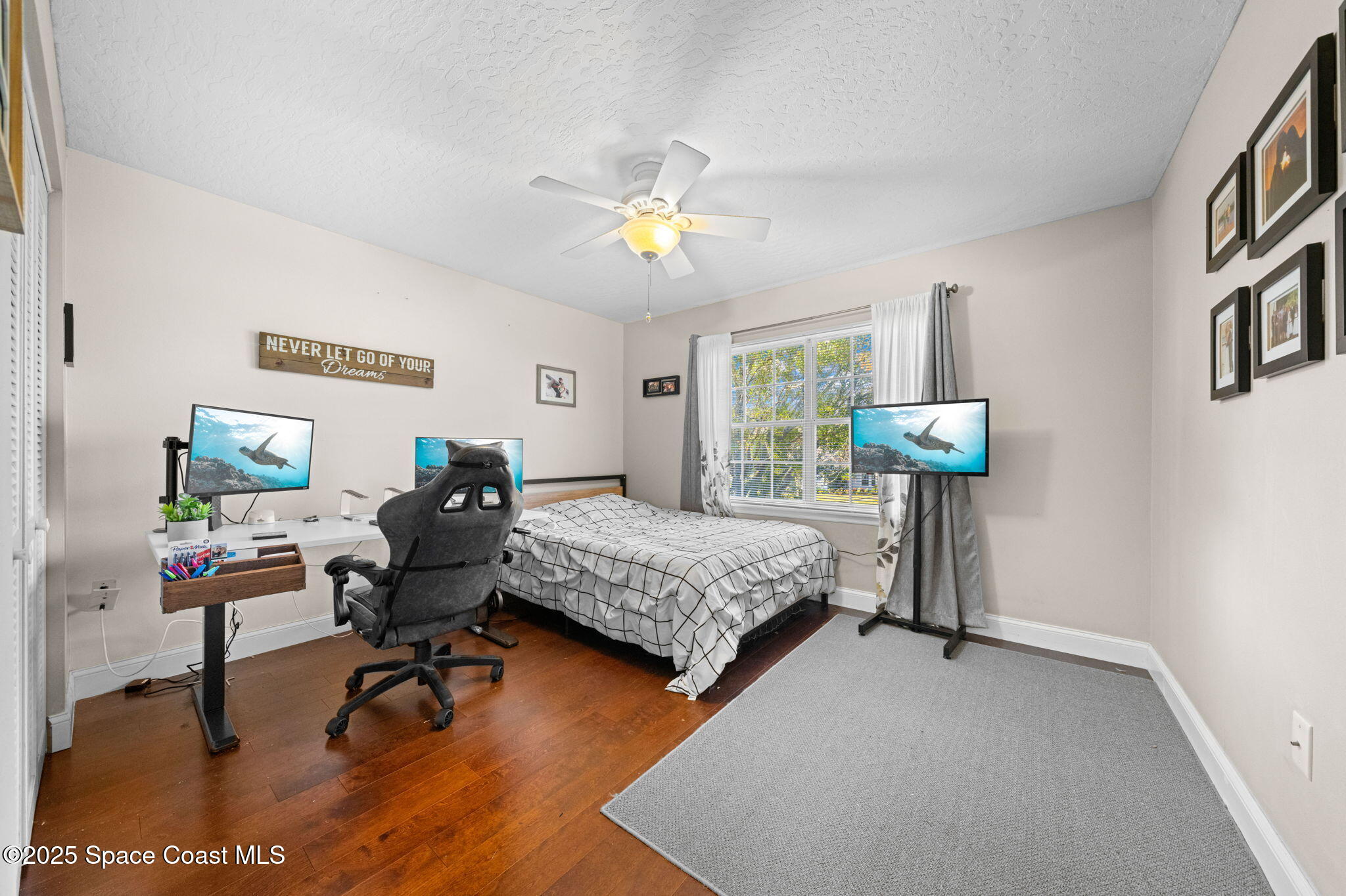 3705 Eagle Way Melbourne, FL 32934 - Photo 36 of 47 a bedroom with furniture and a chandelier