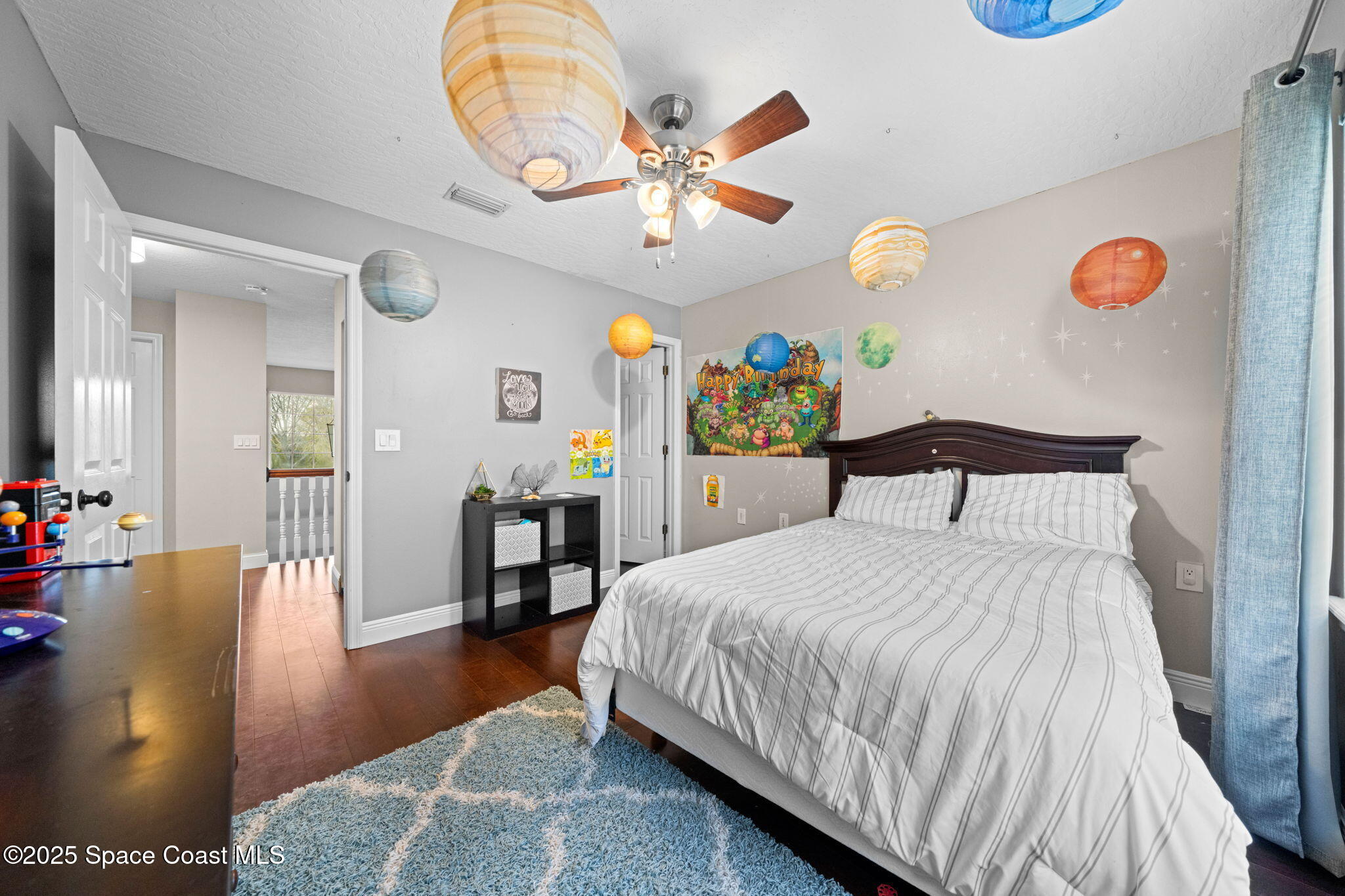 3705 Eagle Way Melbourne, FL 32934 - Photo 40 of 47 a bedroom with a bed and a chandelier