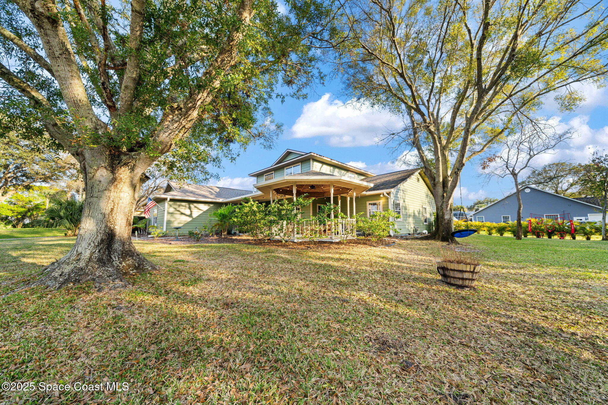 3705 Eagle Way Melbourne, FL 32934 - Photo 4 of 47 a backyard of a house with barbeque oven table and chairs