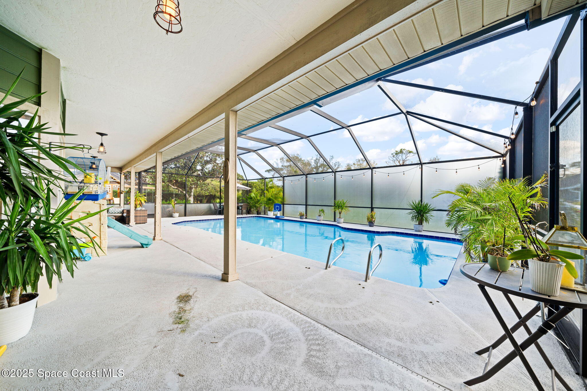 3705 Eagle Way Melbourne, FL 32934 - Photo 45 of 47 a view of a swimming pool with a patio