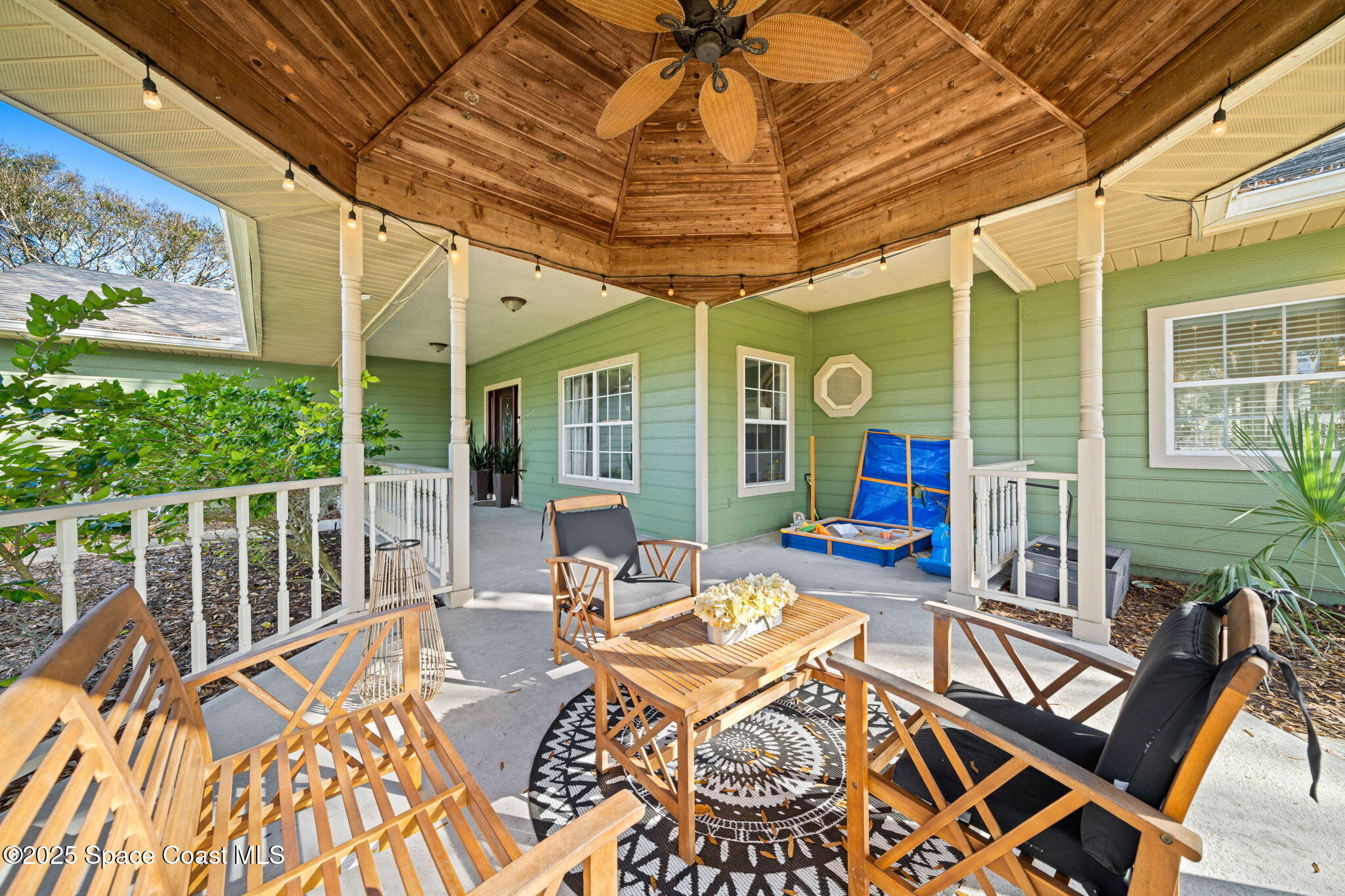 3705 Eagle Way Melbourne, FL 32934 - Photo 7 of 47 a view of a patio with a table chairs and wooden floor