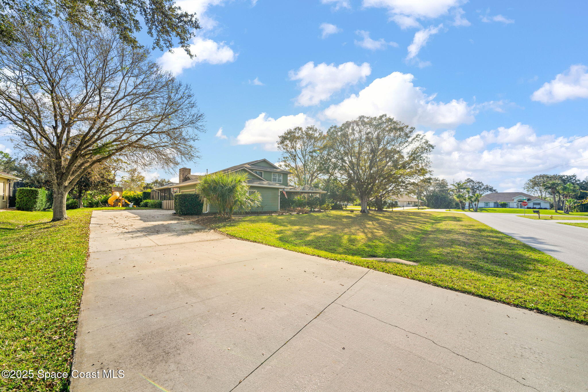 3705 Eagle Way Melbourne, FL 32934 - Photo 8 of 47 a view of yard with swimming pool and green space