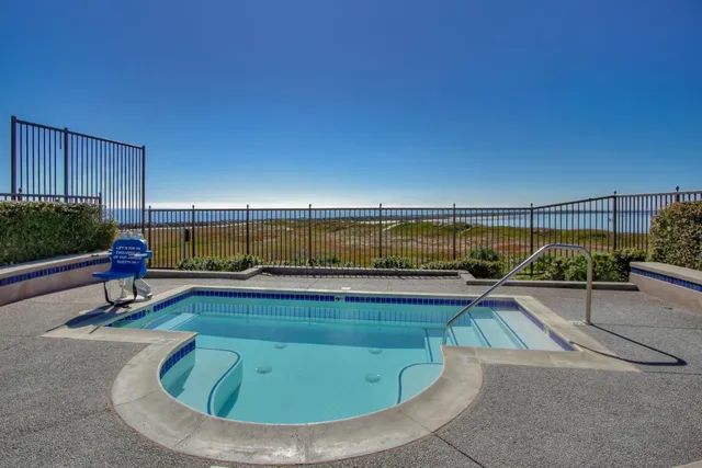 a view of swimming pool with seating area