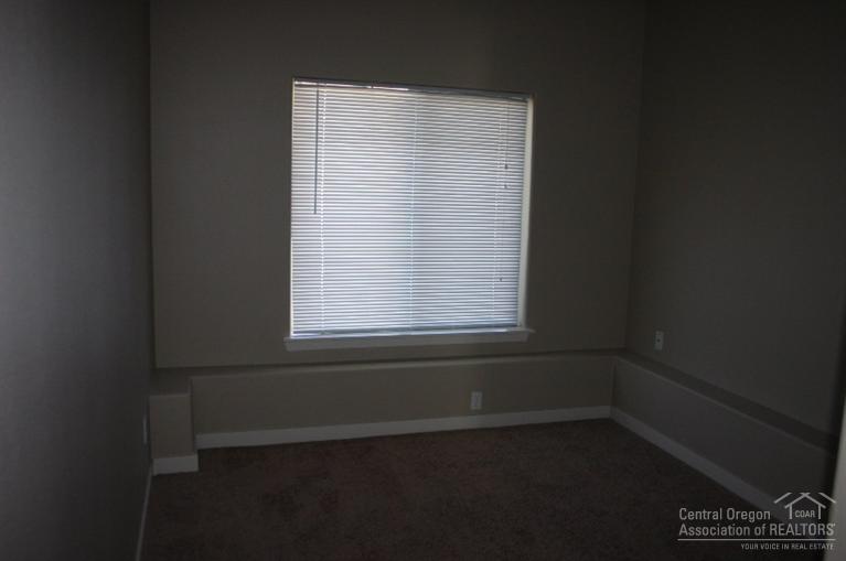 63201 Northeast Boyd Acres Road Bend, OR 97701 - Photo 12 of 14 an empty room with a window