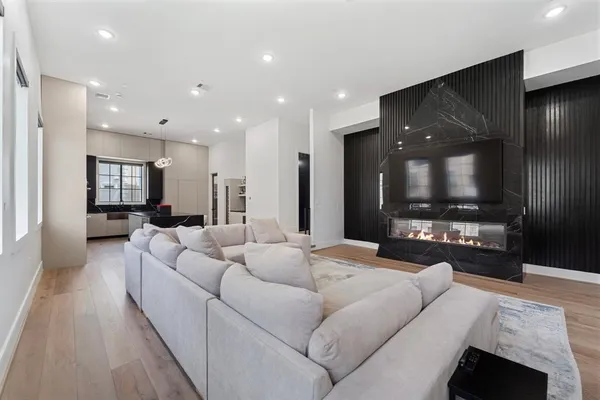 a front view of a residential apartment building with a yard